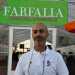 Il 37enne entomologo  Enrico Altini, presidente di Polyxena, associazione che fa parte di Farfalia, davanti all'entrata della "casa", che appare come una normale serra
